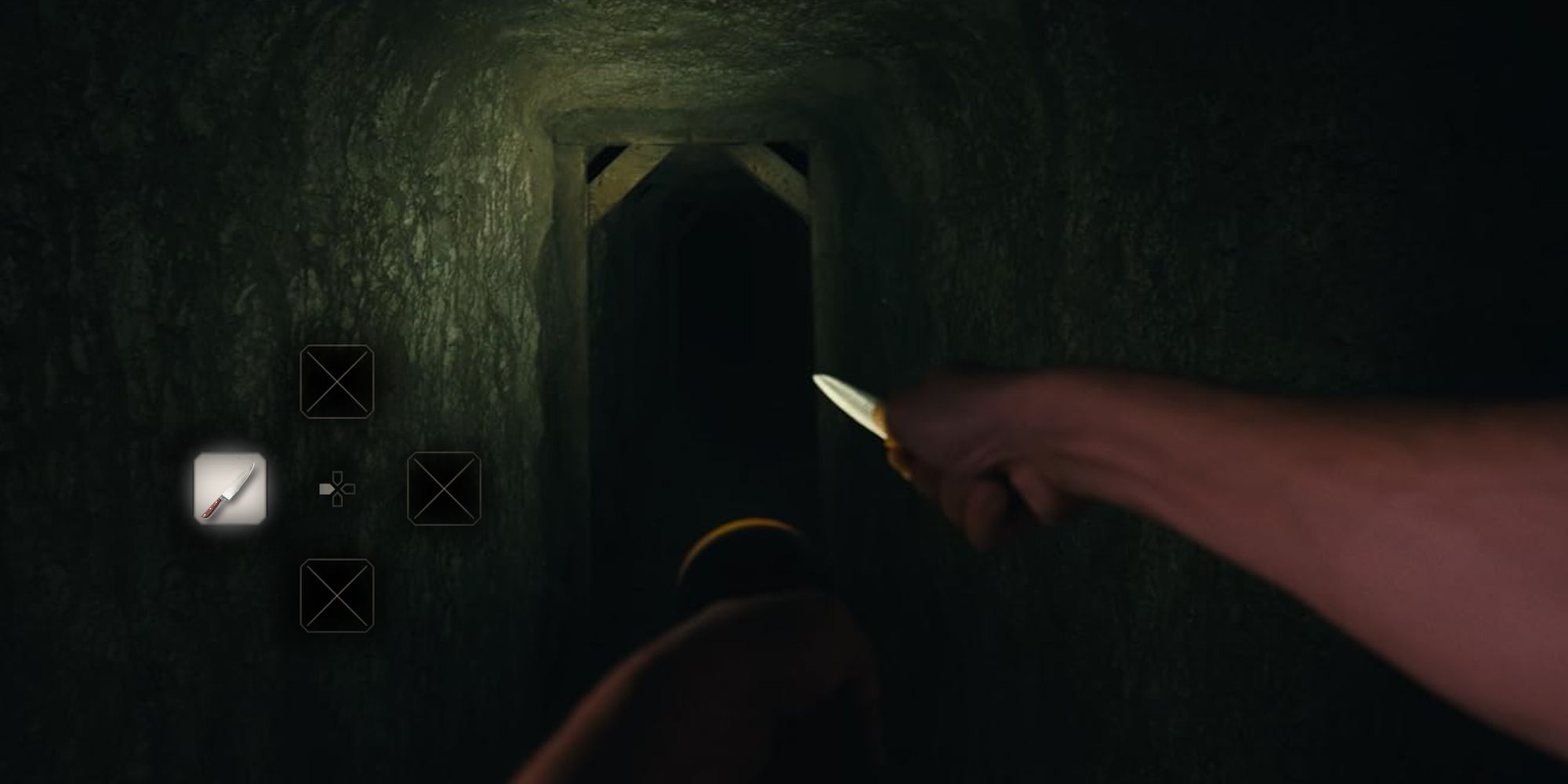 POV of hands holding a knife and a flashlight, walking down the hall of the basement in Barbarian