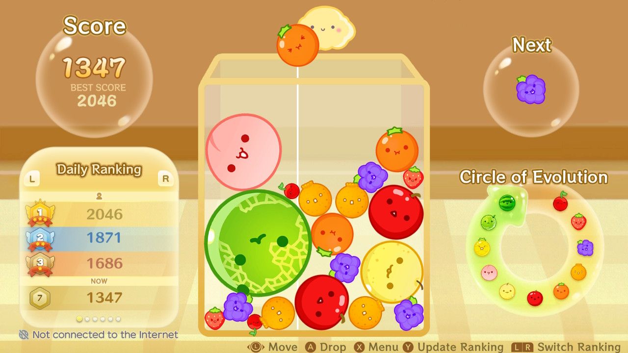 Multiple fruits on the board with the score at 1347 in Suika Game.