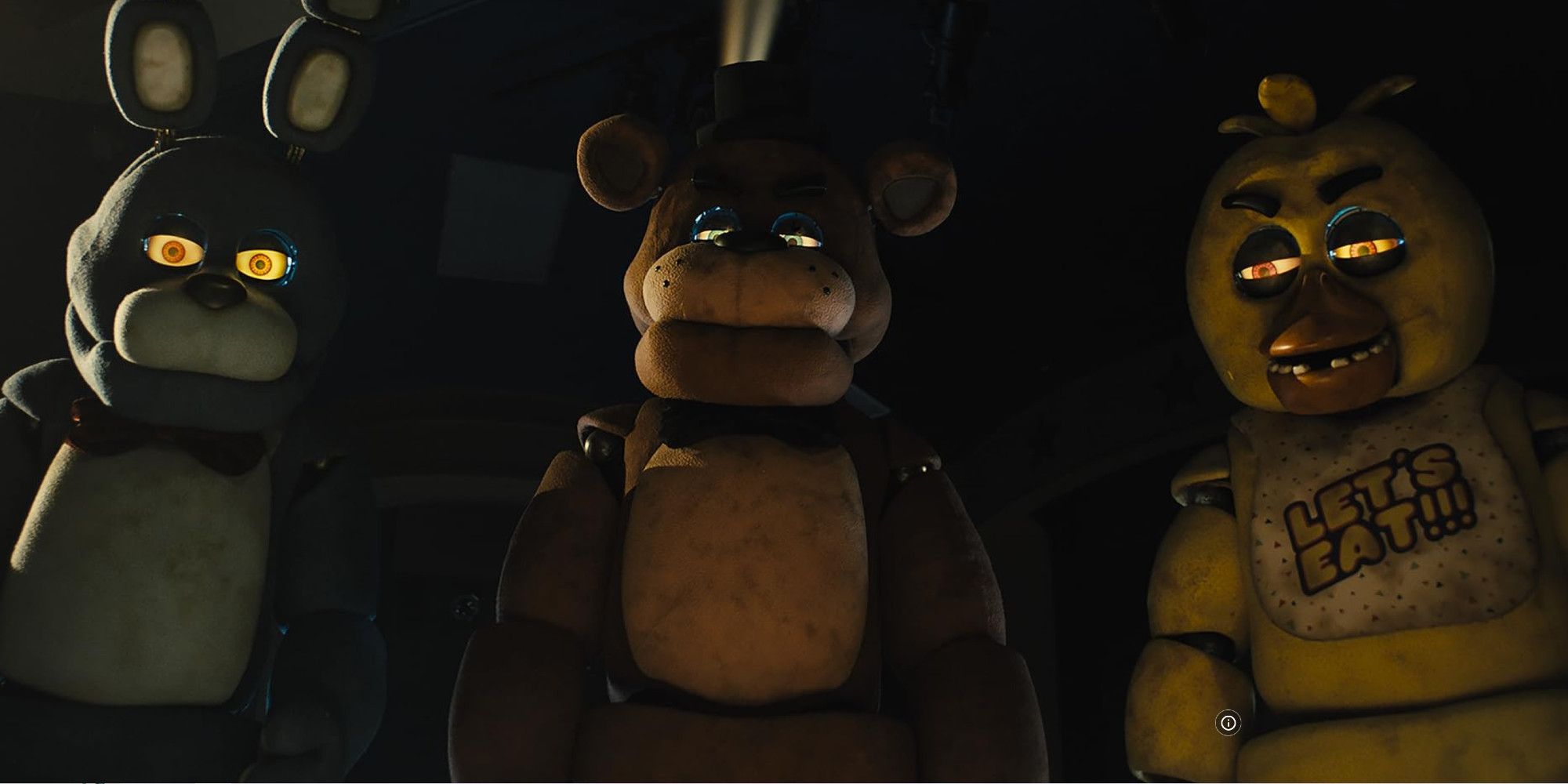 Bonnie, Chika, and Freddy in a dark room looking down at someone in the Five Nights at Freddy's movie