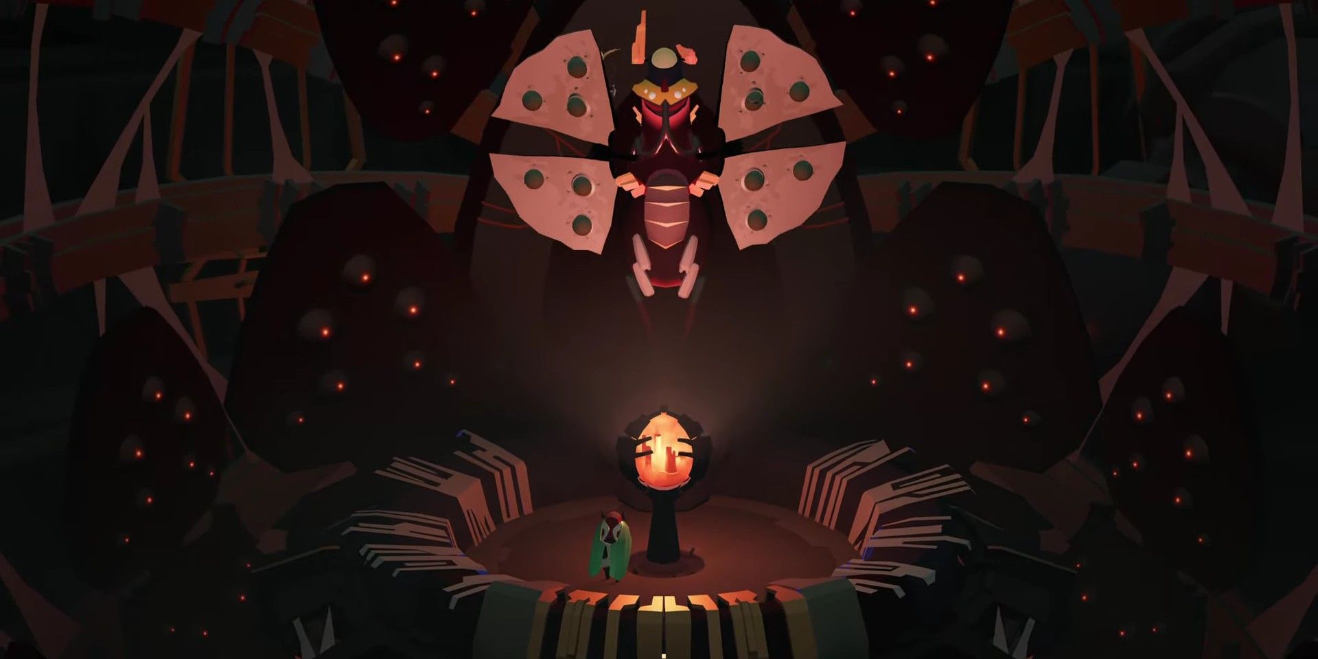 Cocoon screenshot of the main character staring at a large moth like enemy