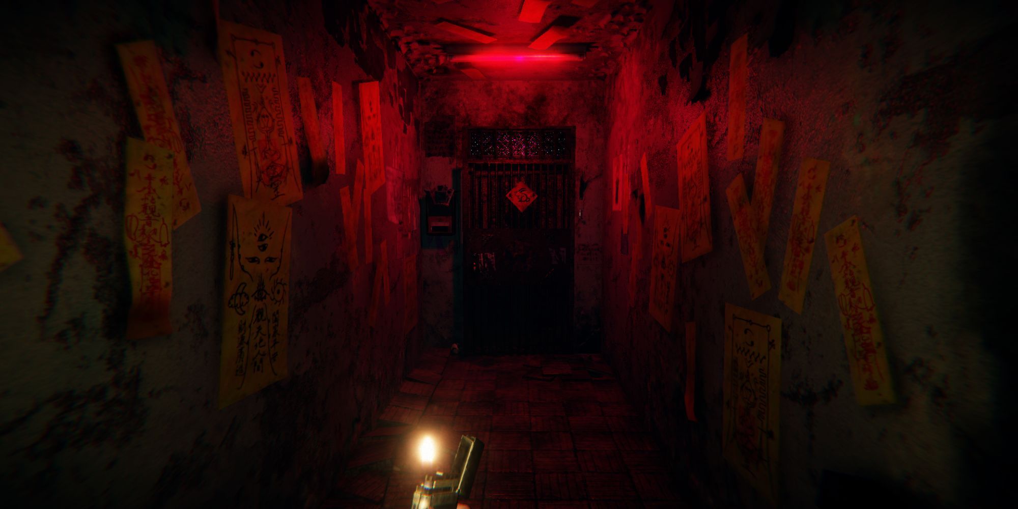 A dark, grungy corridor with a door at the end illuminated by red light.