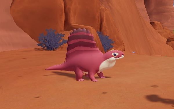 Pink Dimetrodon standing in Ariacotta Canyon near some dry brush during the day in Paleo Pines.