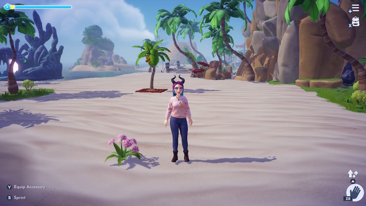 Disney Dreamlight Valley avatar standing near a flower on Dazzle Beach.