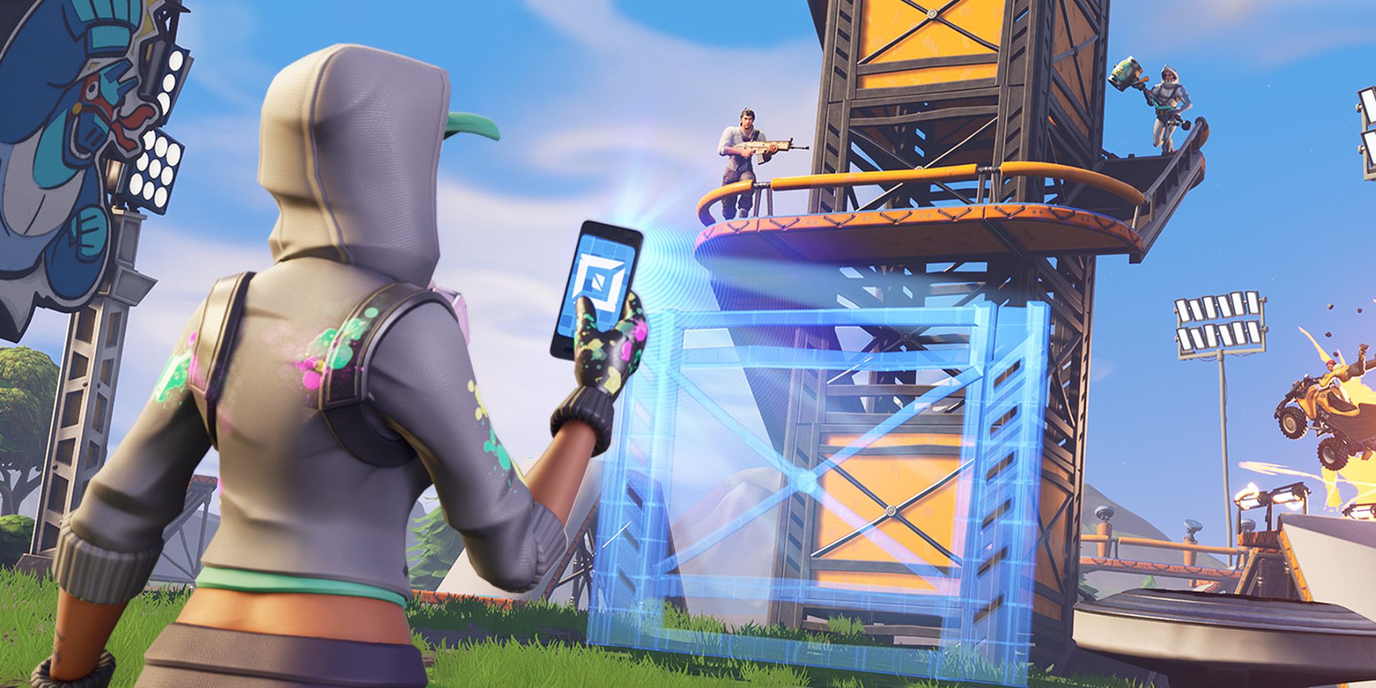 Fortnite character creating a tower with a mobile phone while two other characters run around a balcony on the tower