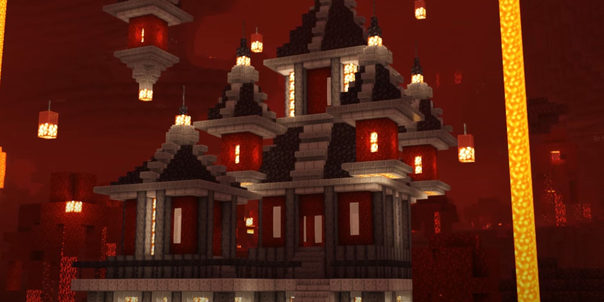 An image from Minecraft of a nether house that has a fantasy aesthetic. This house is made out of crimson blocks and has floating light sources all around the property.
