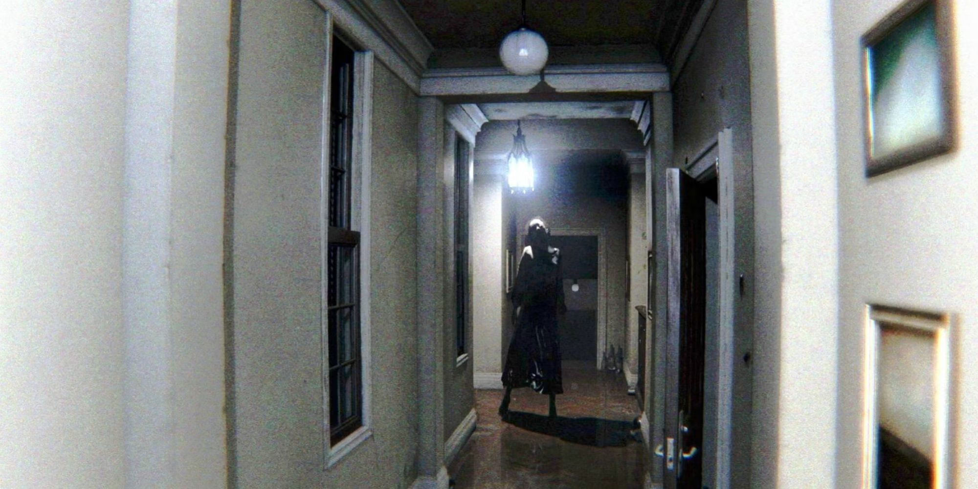P.T. - Lisa stands in a narrow corridor