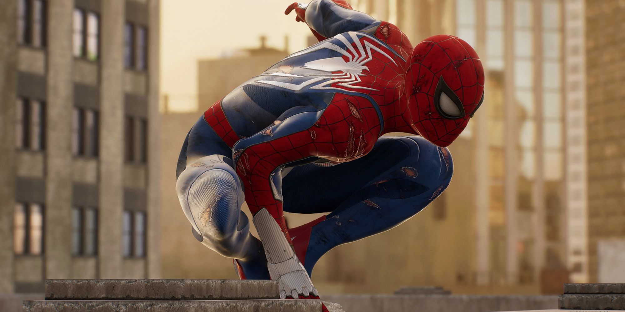 Peter Parker perching on a building in a damaged Spider-Man suit