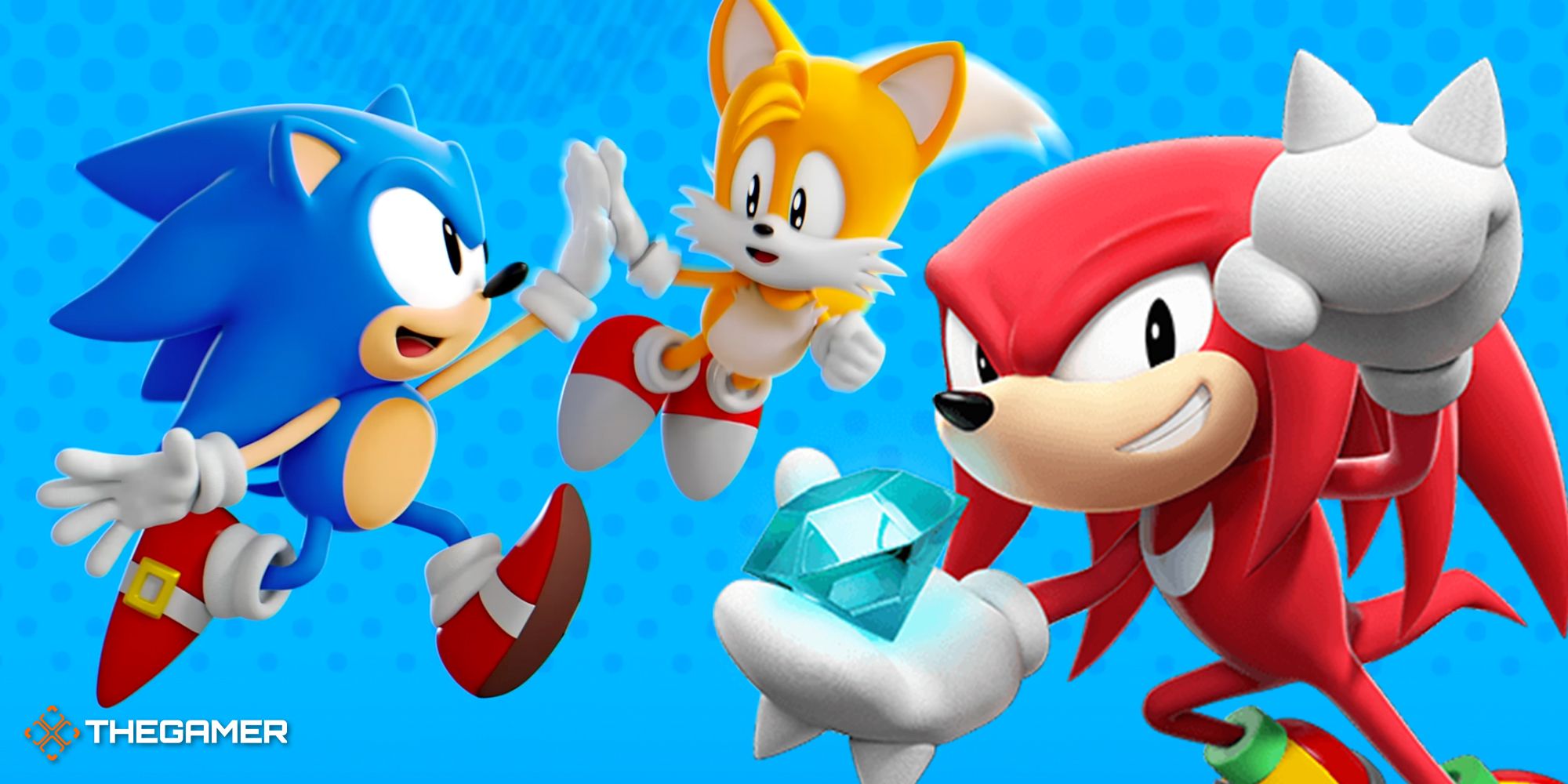 sonic and tails hitting a high five, and knuckles holding a chaos emerald in superstars