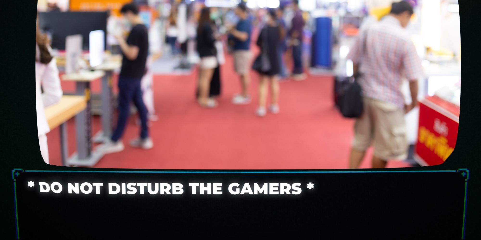 A blurry photo of a gaming convention with text that says 'Do not disturb the gamers'.