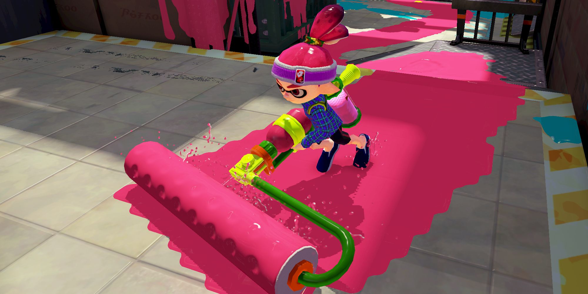 Splatoon 1 character rolling a trail of pink paint with a giant horizontal paint brush attached to a gun
