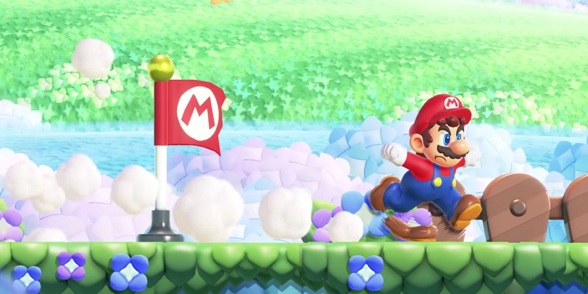 Mario running past the checkpoint flag in Super Mario Bros. Wonder.