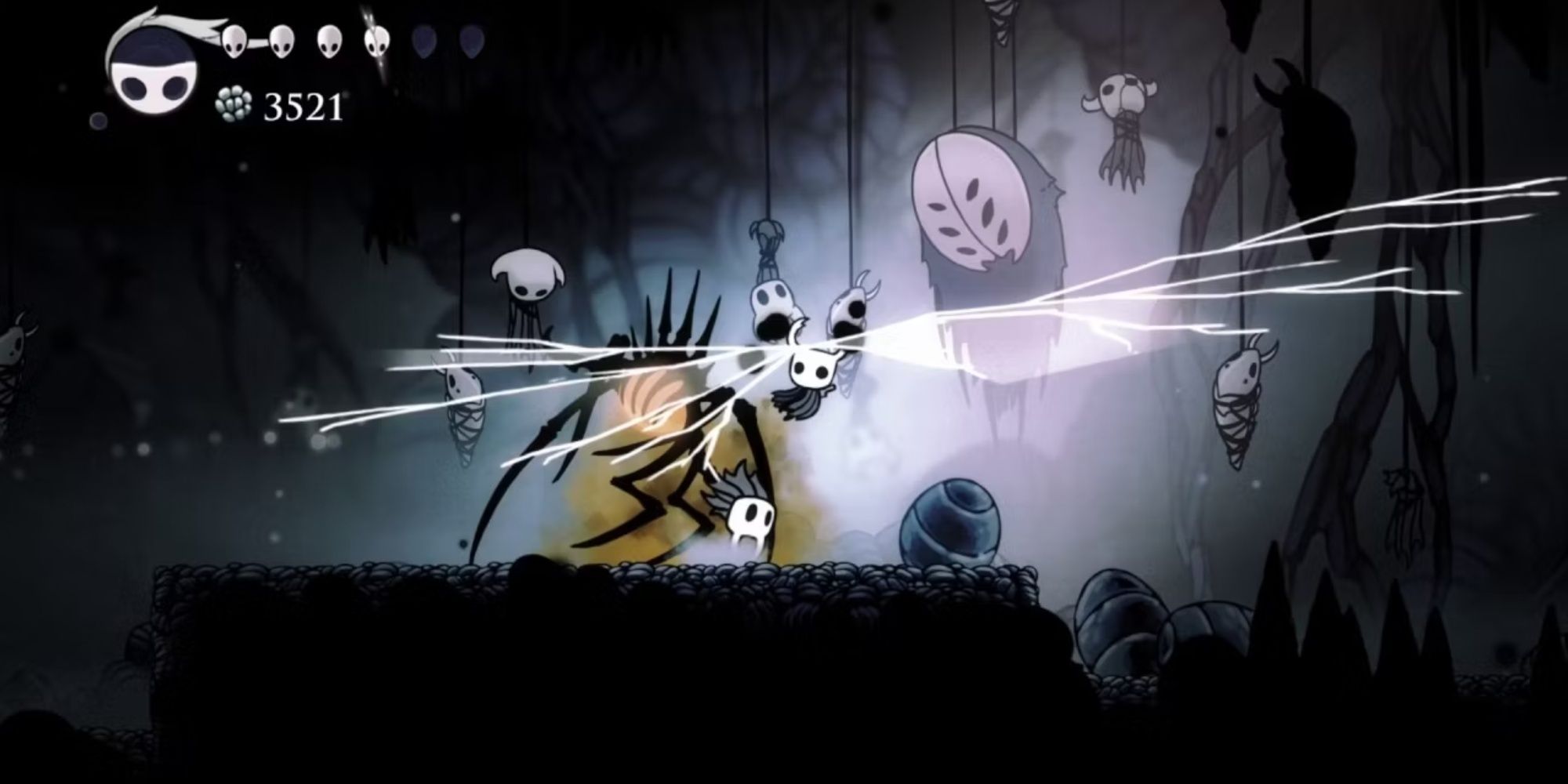 The Knight fighting a boss in Deepnest in Hollow Knight