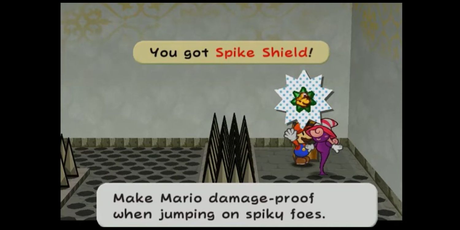 Mario stands at the end of a spike maze holding the Spike Shield badge