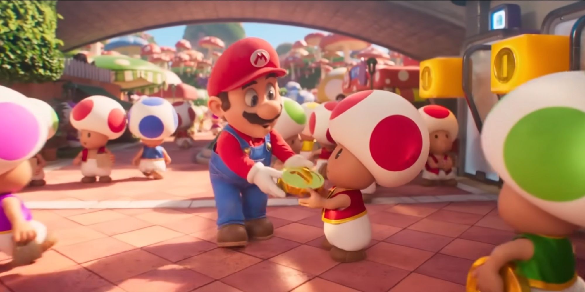 mario giving a red toad a coin in the super mario bros movie
