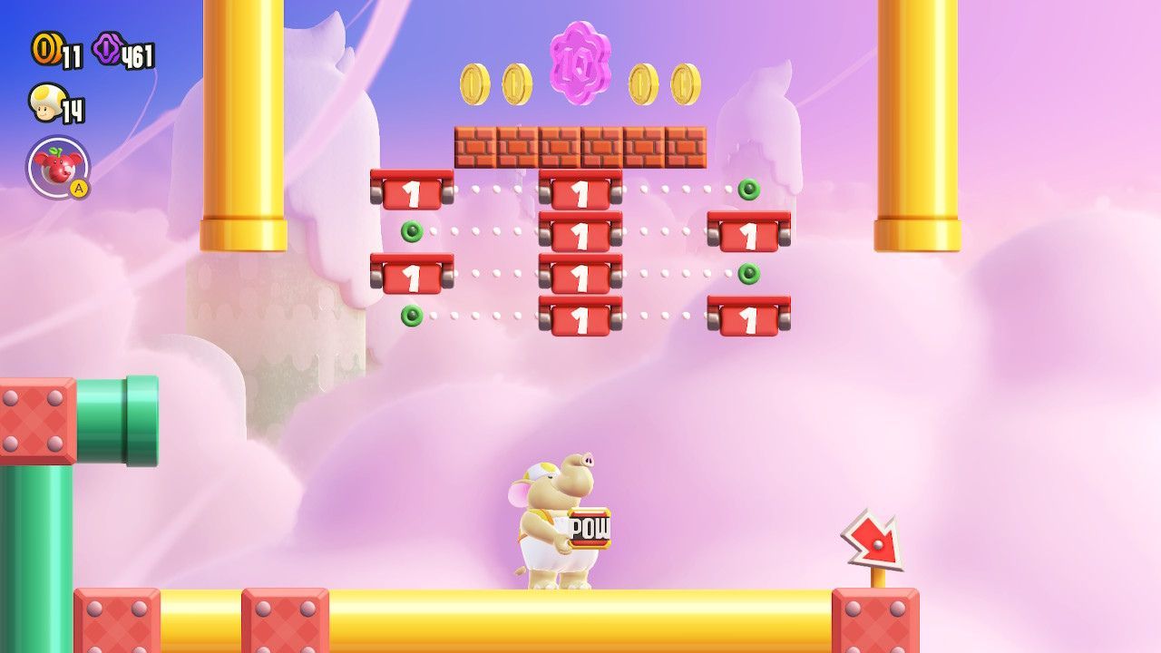 A 10-flower coin on a set of bricks above a series of small countdown platforms.