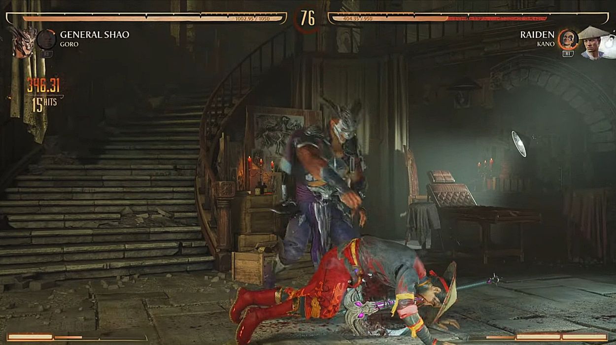 General Shao standing while Raiden is attached with Shao's axe in Mk1.