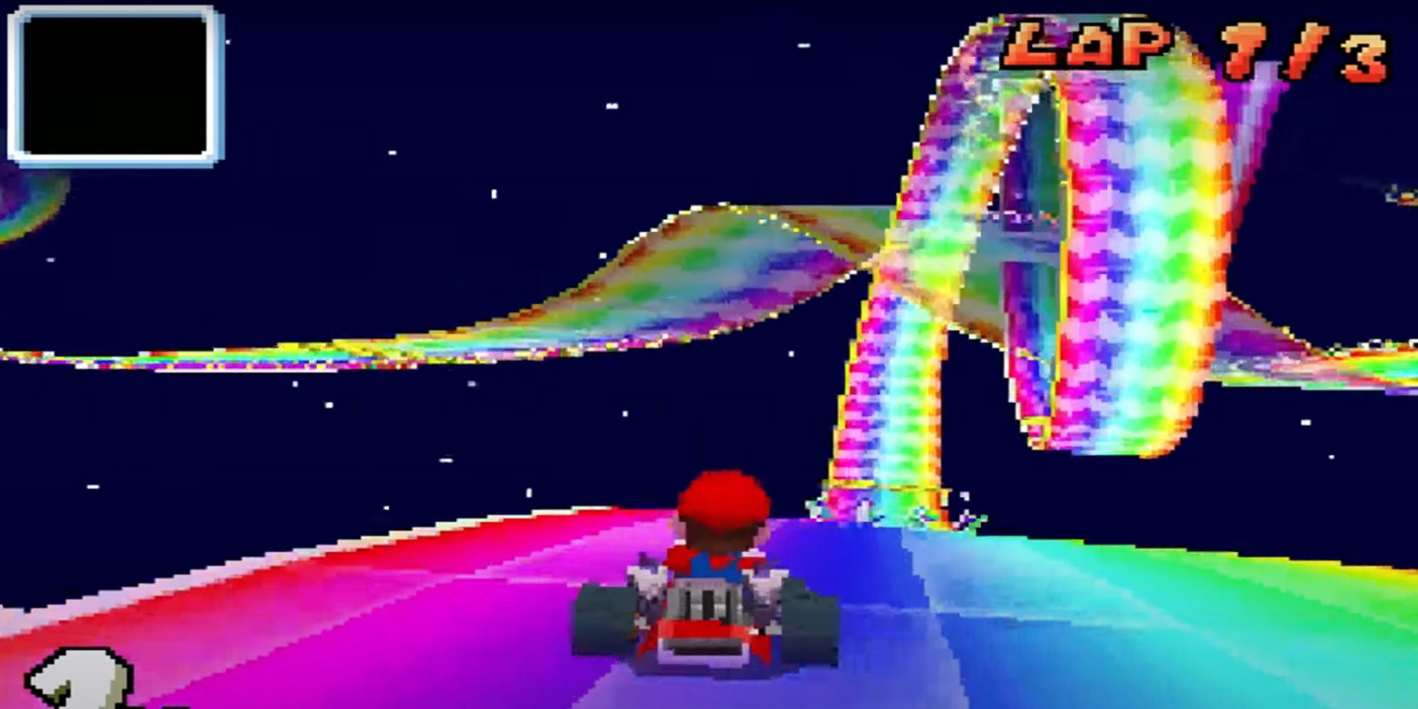 Mario about to go through a loop in Rainbow Road in Mario Kart DS.