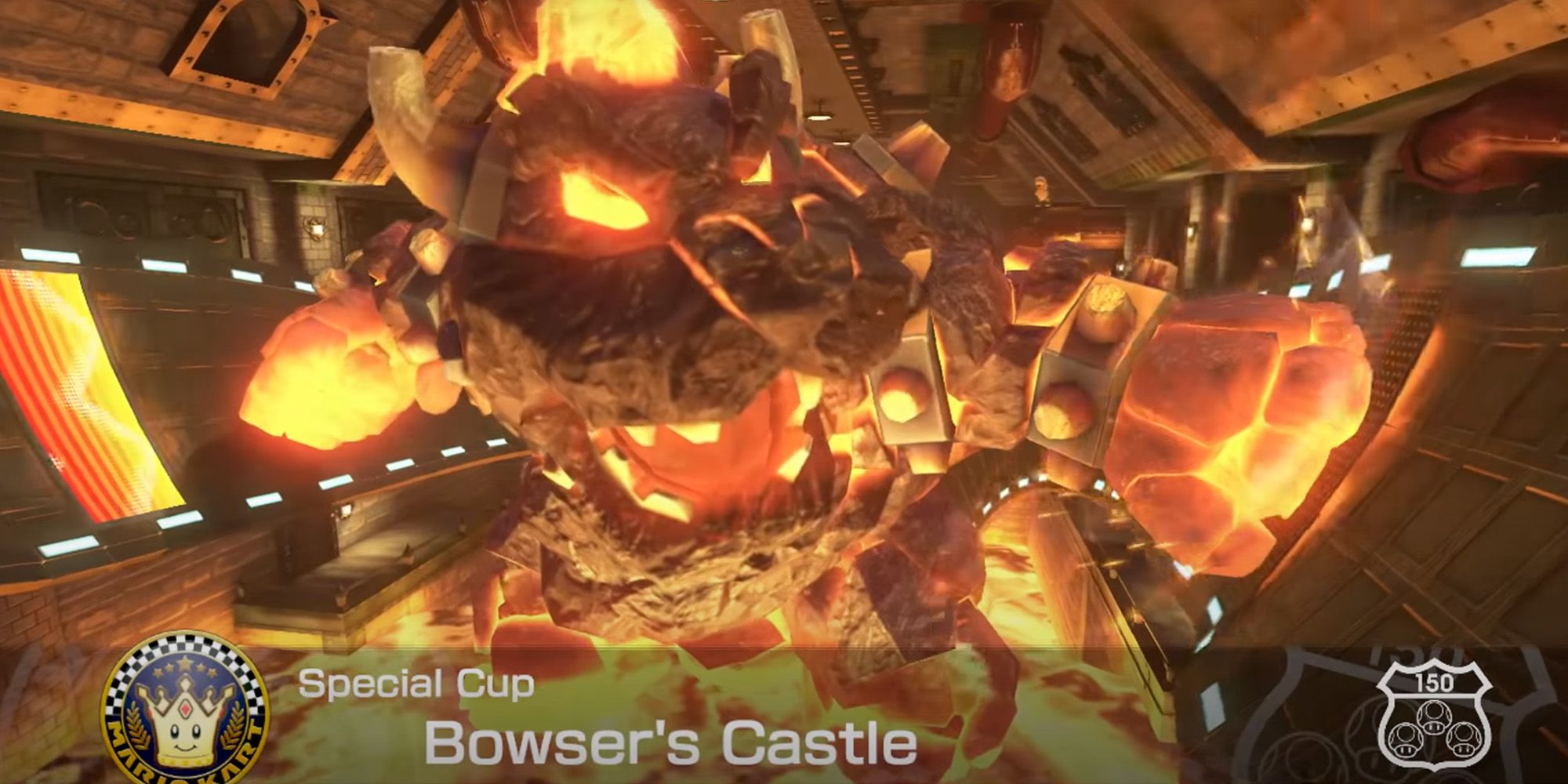 Mario Kart 8 Deluxe - A giant Bowser statue punching the track in Bowser's Castle