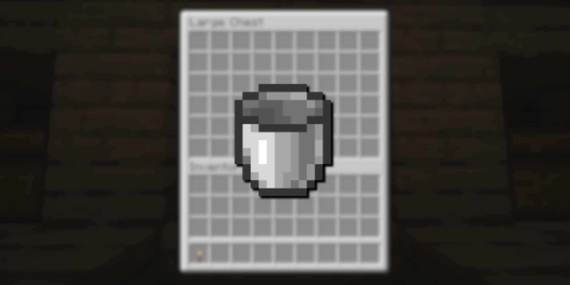An iron bucket from Minecraft with light reflecting off one side overlayed over a blurred chest inventory.