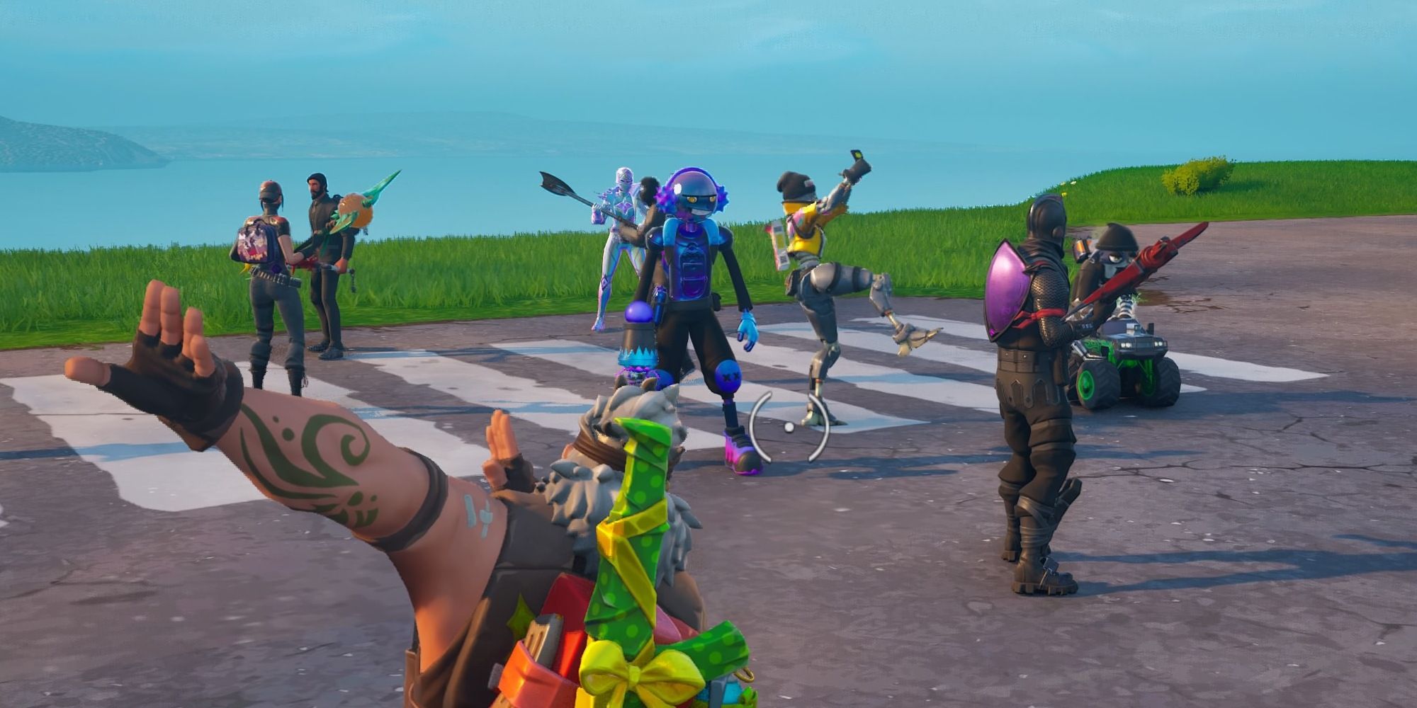 Several players emote and wait for the Battle Bus on the lobby island of OG Fortnite.