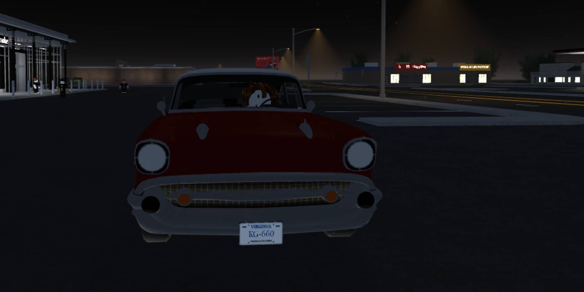 Roanoke player in a classic car in a car park, red car, 1950s style american