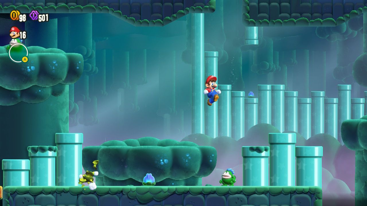 Mario jumping up from a platform toward a set of three pipes. 