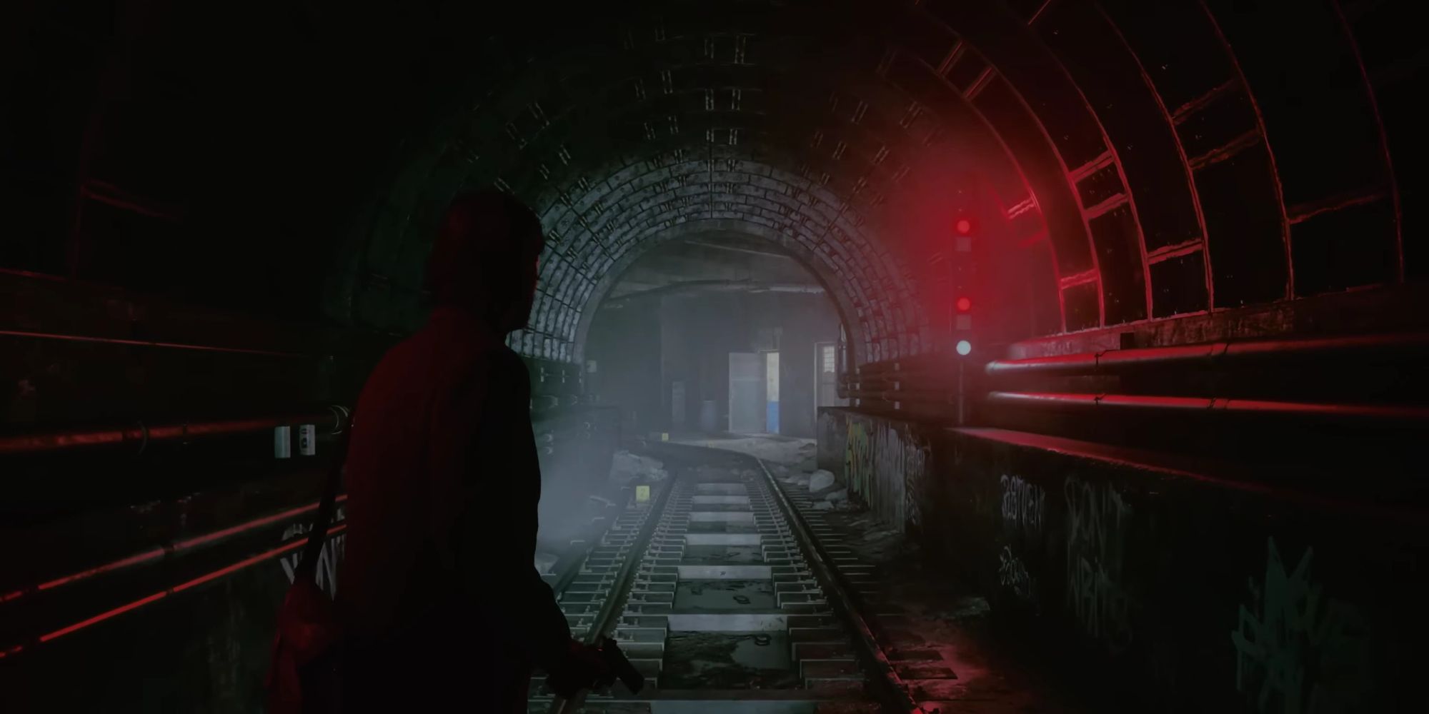 A player walking through the subway tunnels in Alan Wake 2
