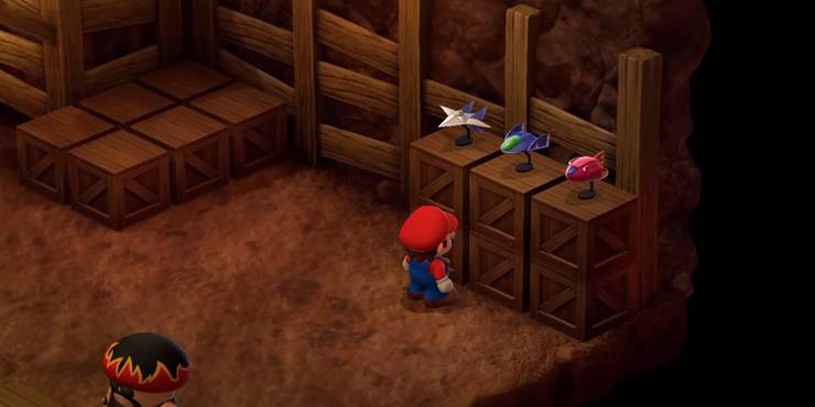 super-mario-rpg-easter-eggs-secrets-and-hidden-details-super-mario-rpg-remake-mario-looking-at-models-of-the-arwing-from-star-fox-and-captian-falcon-s-blue-falcon-and-fire-stingray-from-f-zero.jpg (740×370)