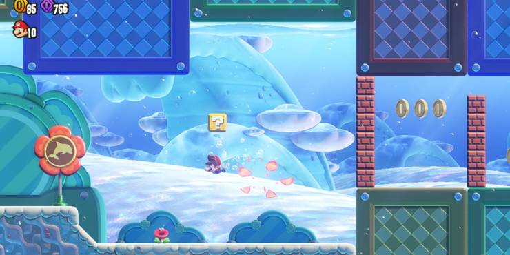 Mario swimming underwater underneath a question block.