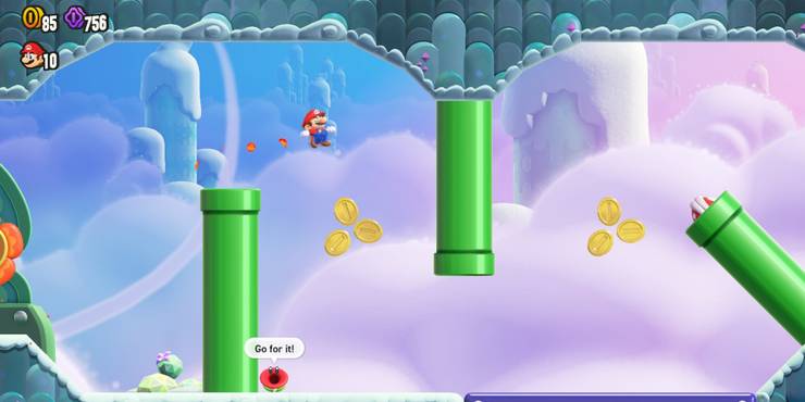 Mario jumping over a pipe and some coins.