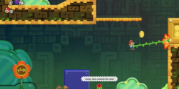 Mario using the Grappling Vine to grab onto a wall.