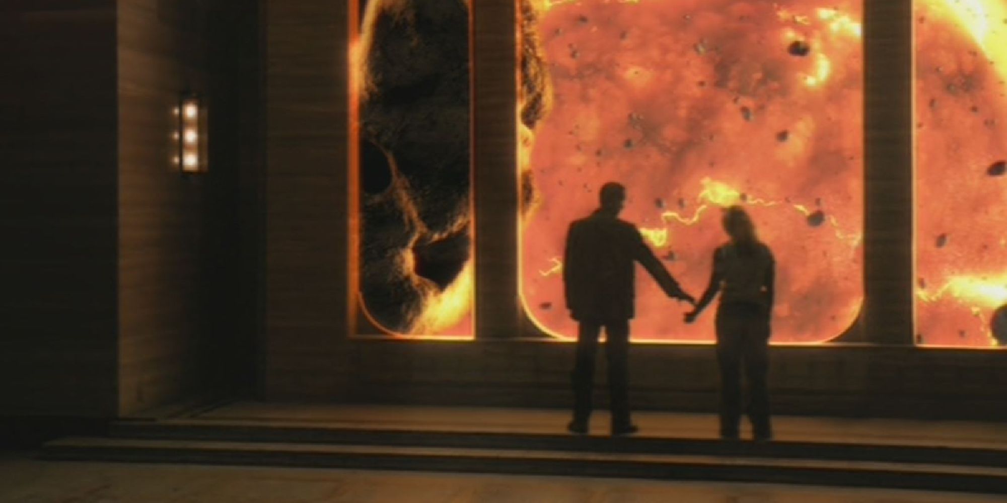 The 9th Doctor going to hold Rose's hand as they watch the Earth burn in Doctor Who's The End of the World