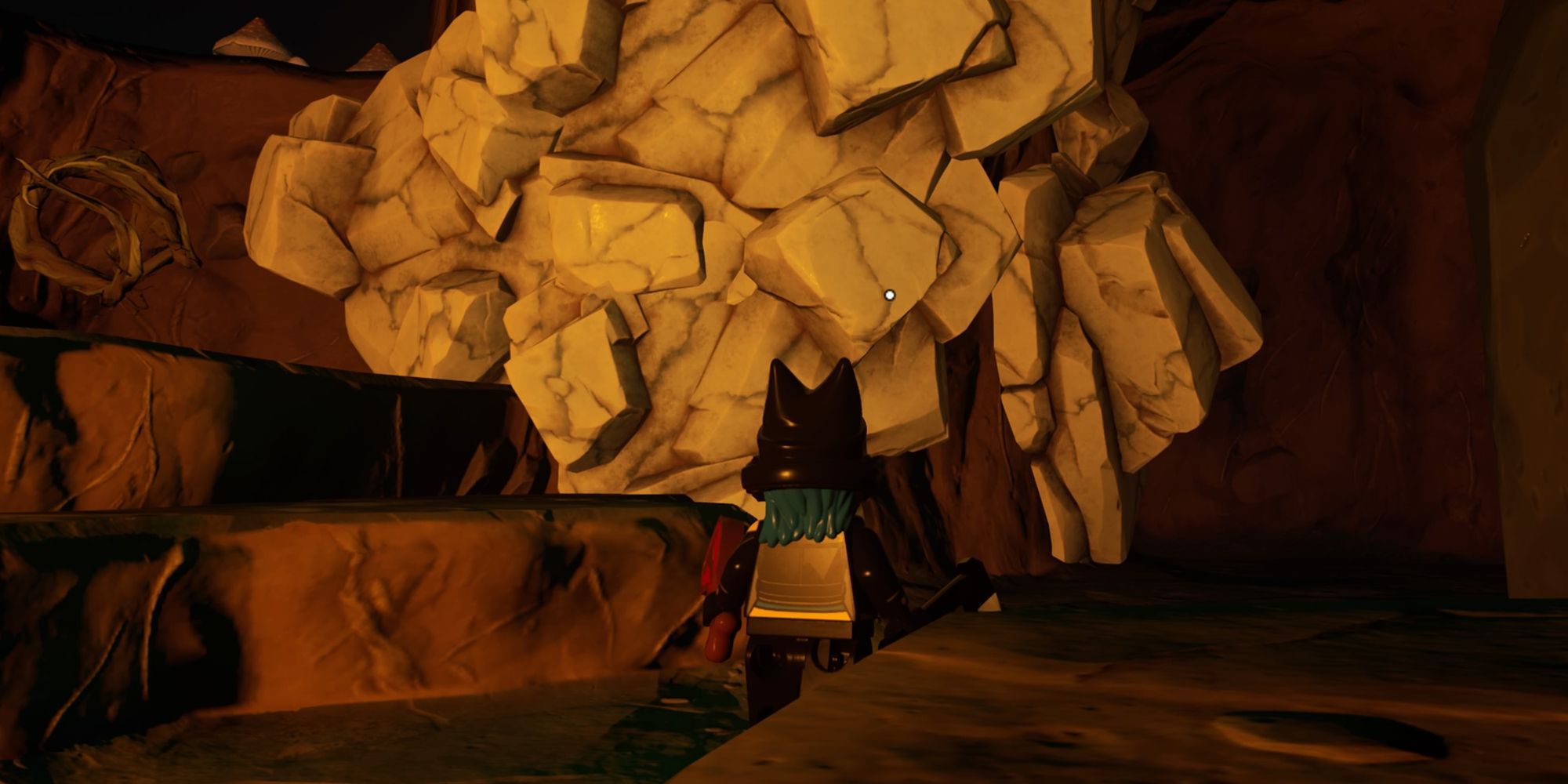 A character beside some marble in a cave in Lego Fortnite.
