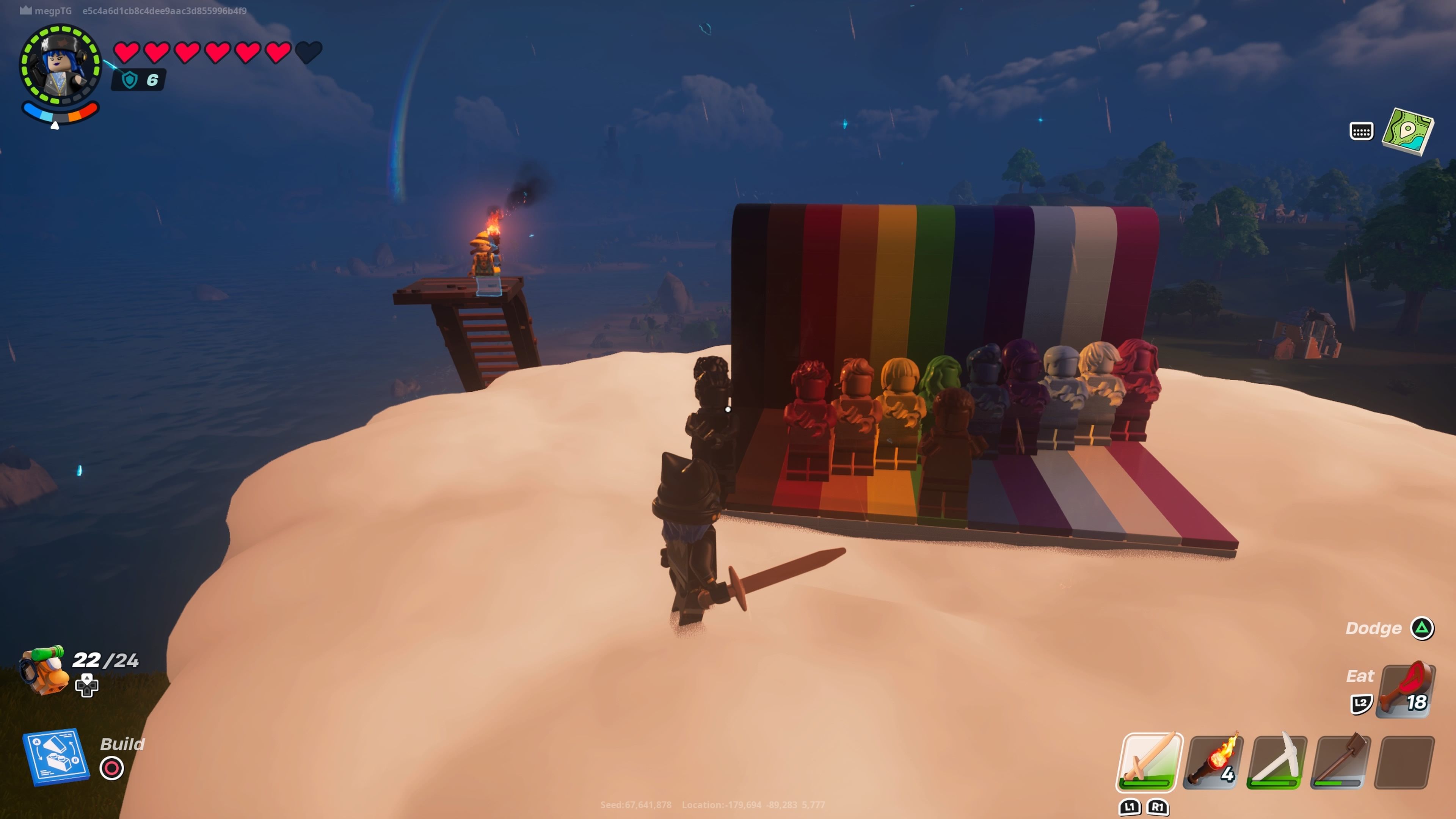 A player beside the rainbow coloured lego figures dancing at the end of the rainbow in Lego Fortnite.