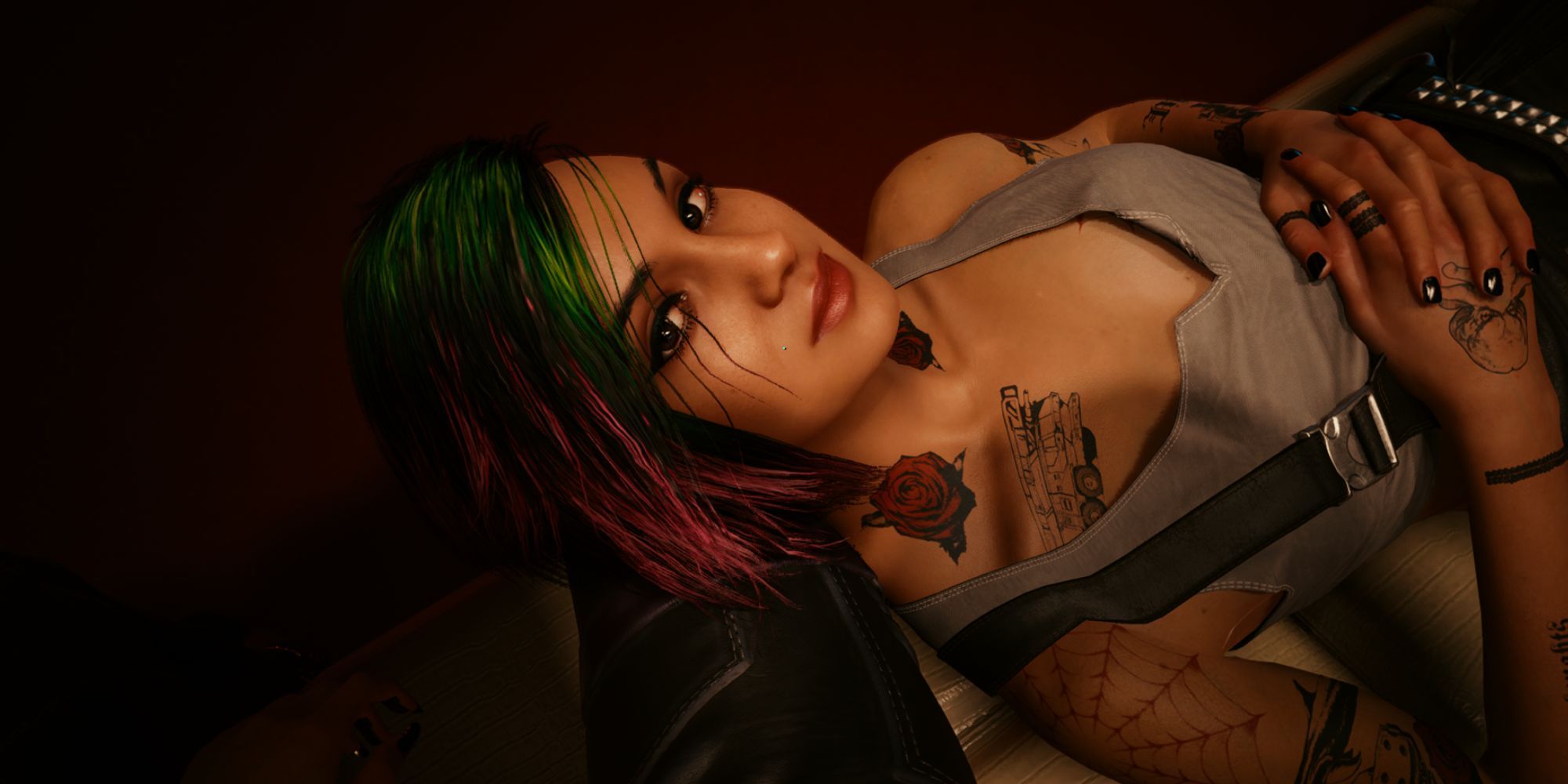 Judy from Cyberpunk 2077 lying on the player character's lap, looking up at them