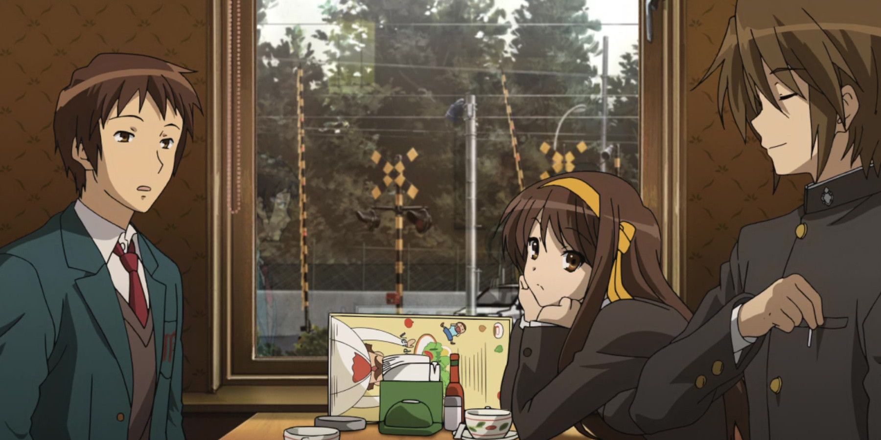 Screenshot from The Disappearance of Haruhi Suzumiya showing Haruhi, Koizumi and Kyon sitting together