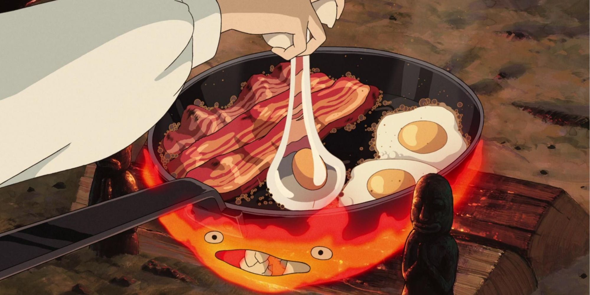 Frying eggs and bacon in a pan in Howl's Moving Castle