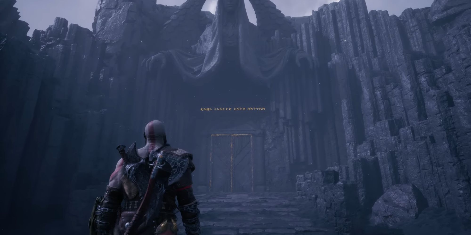 Kratos walks toward the entrance of Valhalla