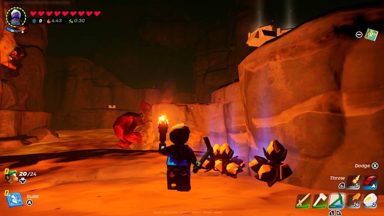 A Lego player holds up a torch to look at dropped pieces of Brightcore.