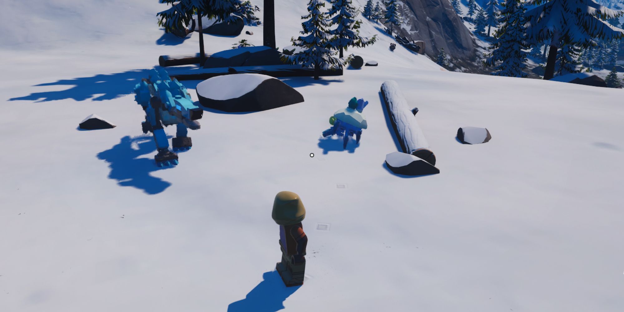 A snowy biome showing some trees, a rock, a large blue wolf, and a small, crab-like enemy covered in snow.
