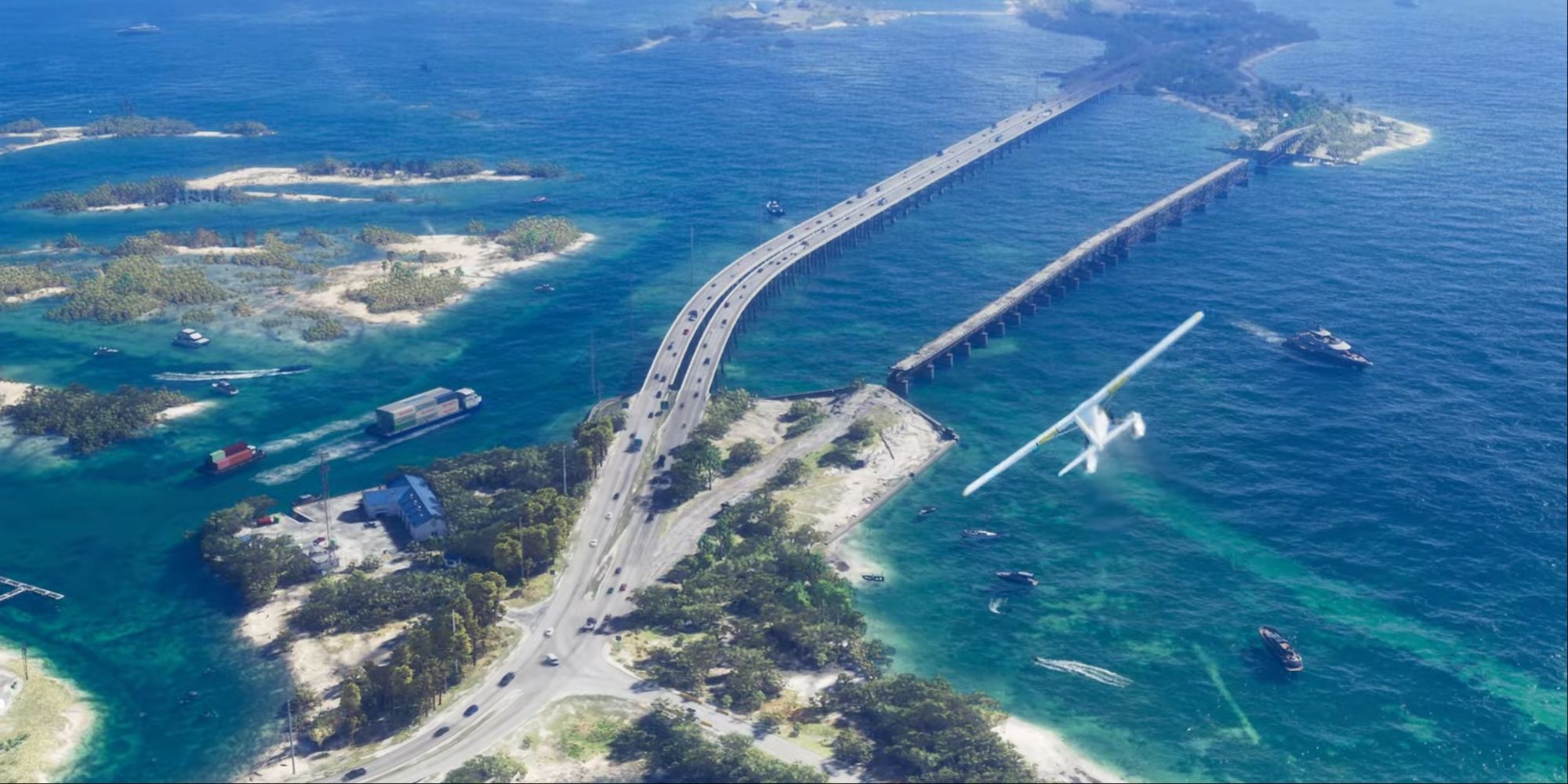 An airborne seaplane making a turn over a highway system going across the ocean.