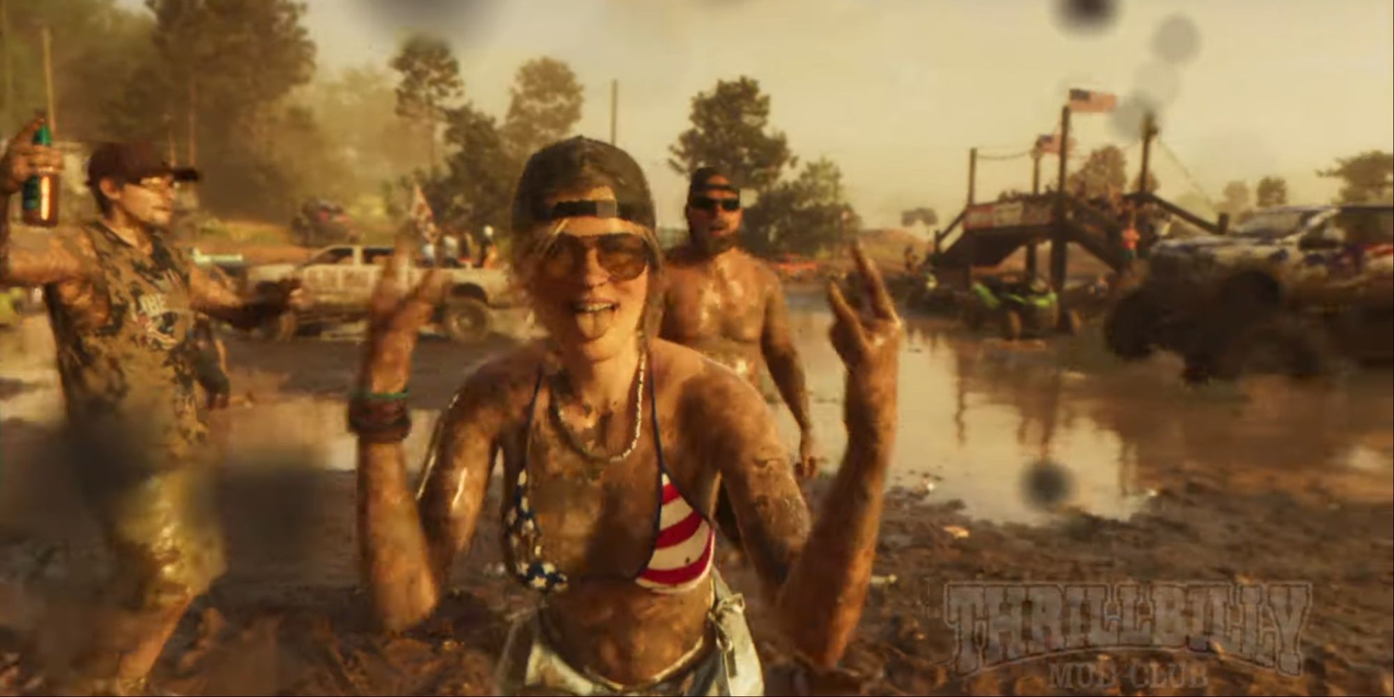 A trio of characters covered in mud, one with beer, another one shirtless with a cap and sunglasses, and a woman in an American flag bikini throwing up the 'rock out hand sign and sticking out her tongue to the camera