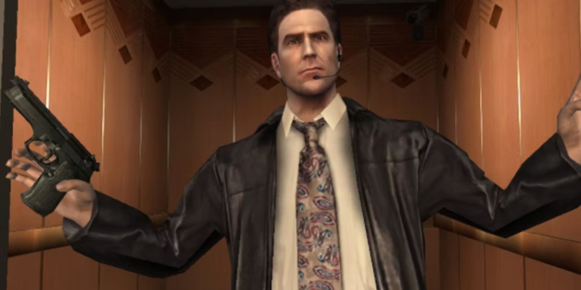 Max Payne putting his arms up in surrender, his iconic tie, leather jacket, and white dress shirt clearly seen.