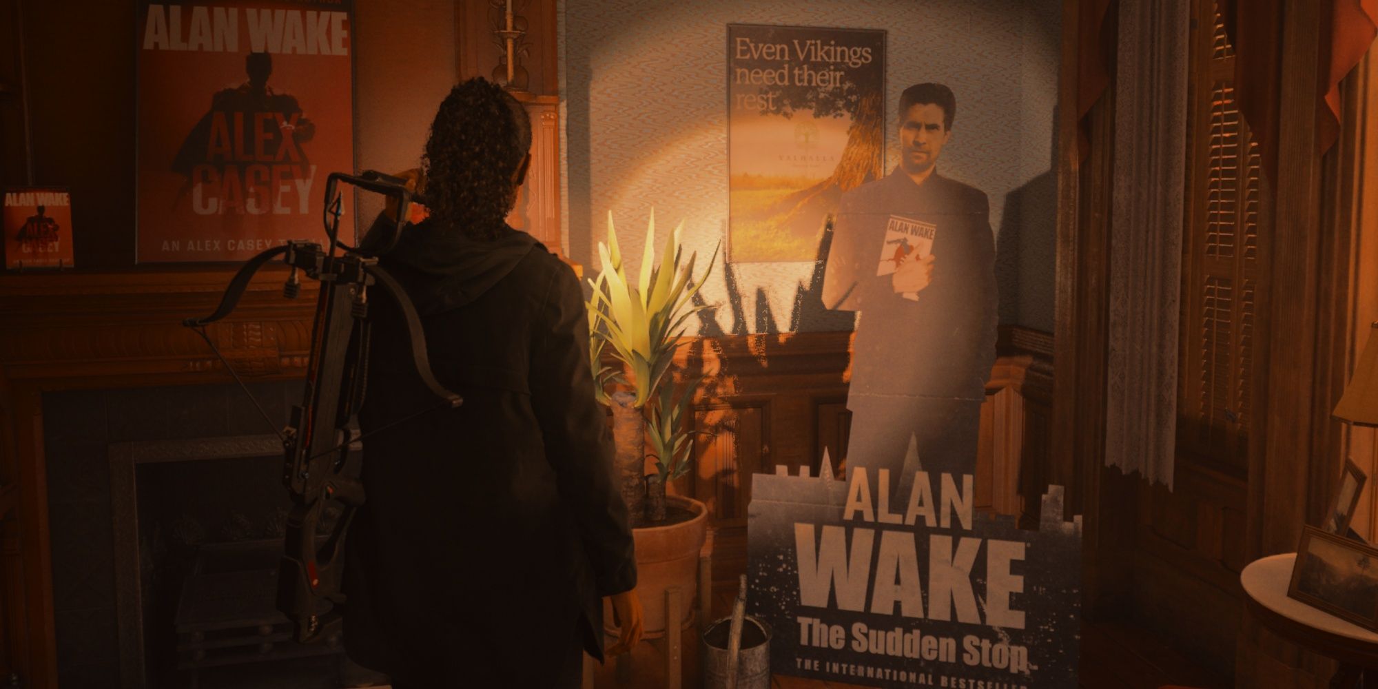 Saga standing in the middle of a room dedicated to Alan Wake's works, pointing a flashlight at his cardboard standee holding a copy of The Sudden Stop, and more Casey book posters on the wall and mantle.