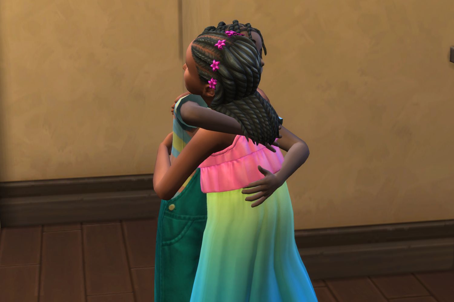 Two child Sims hug in The Sims 4