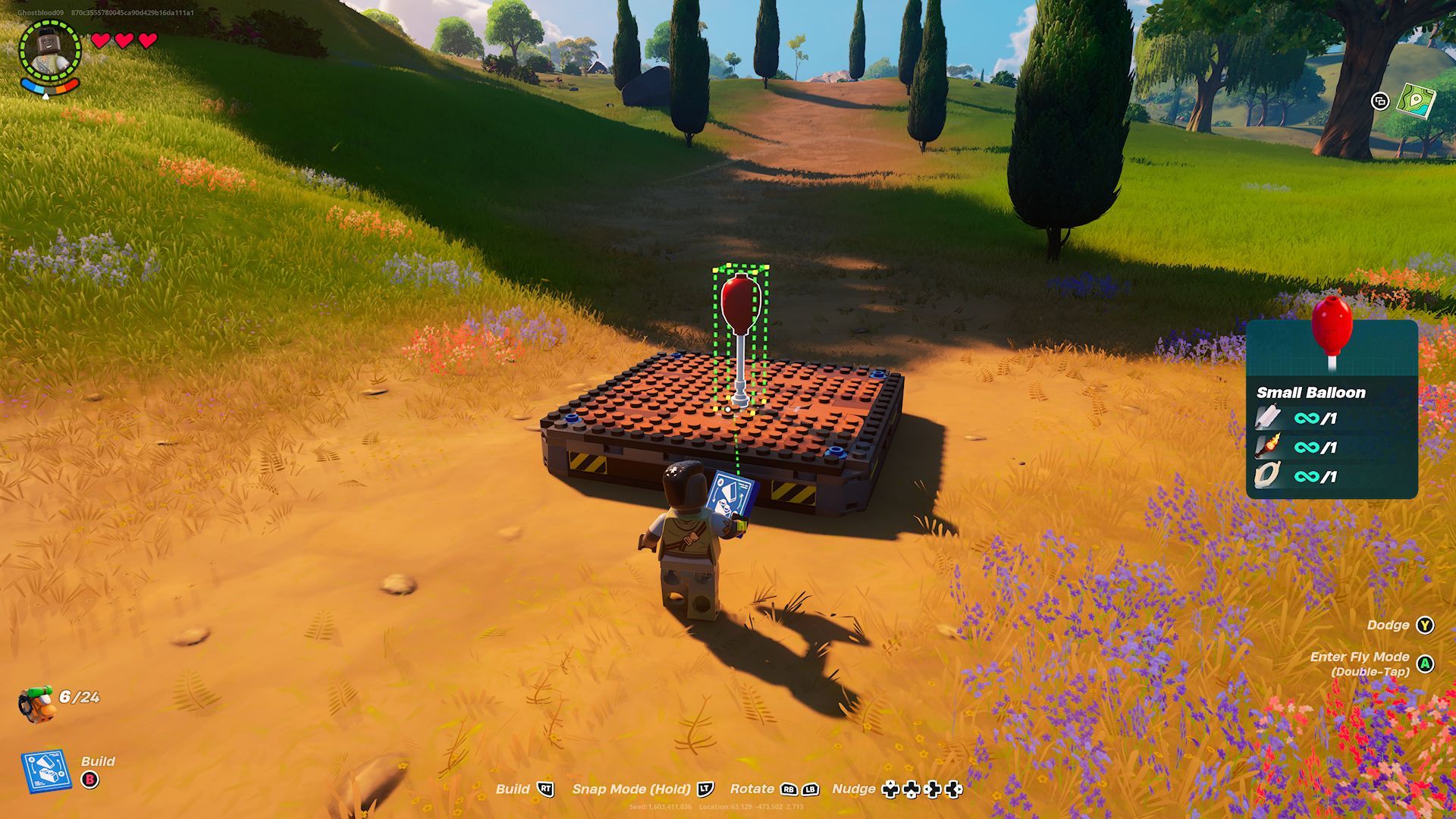 A player placing a Small Balloon onto a Dynamic Foundation in the middle of a dirt path in Lego Fortnite.