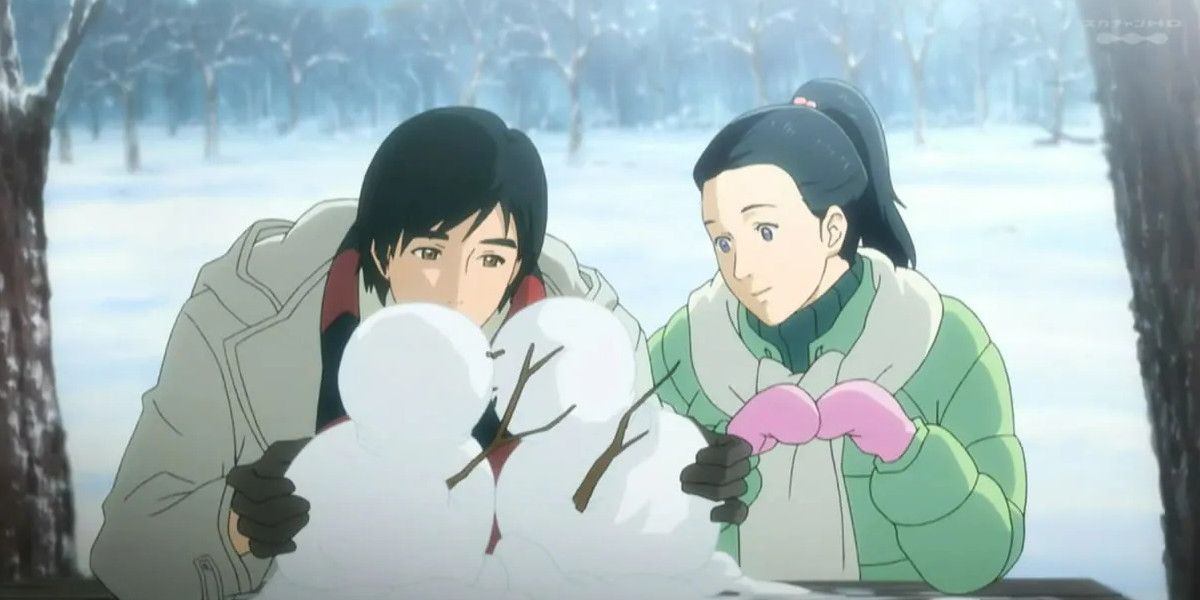 Screenshot from the Winter Sonata anime showing the two leads building snowmen together.