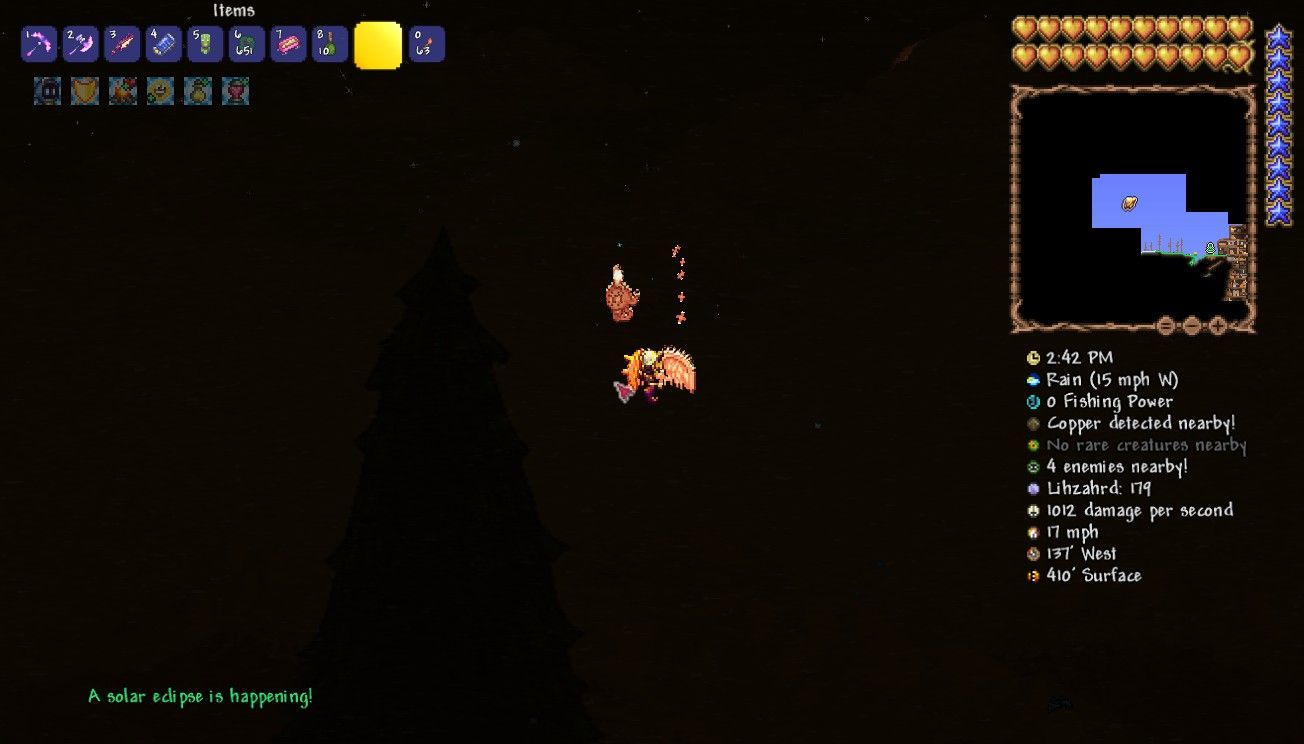 Player character flying in the air during a blizzard and green text stating a solar eclipse is happening is on the screen in Terraria.