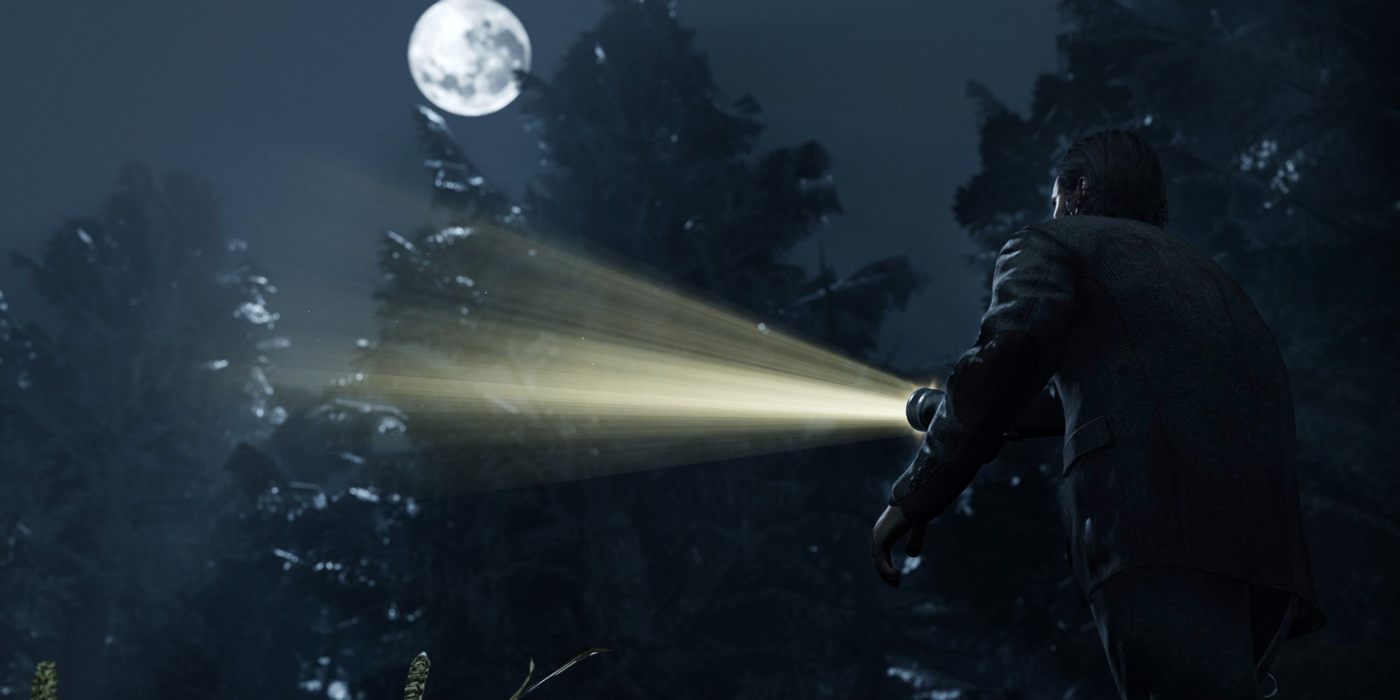 Alan Wake with a flashlight in the middle of a forest with a full moon overhead