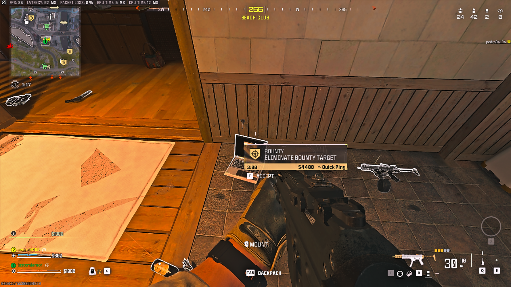 Player looking at a bounty contrat laptop on the floor in Call of Duty Warzone